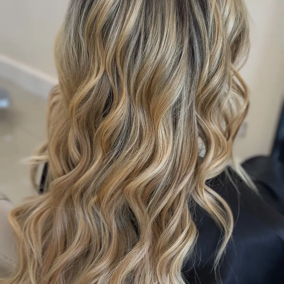 Long blonde balayage waves styled by Kayla at Sweets Hair Shop